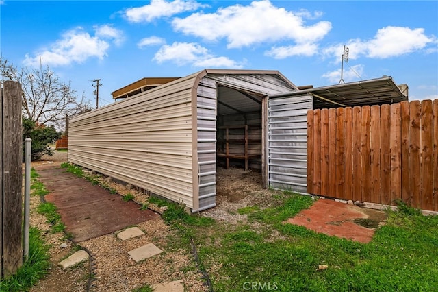 view of pole building with fence