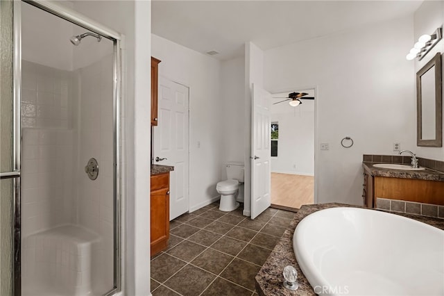 full bathroom featuring a stall shower, vanity, a tub, tile patterned flooring, and ceiling fan