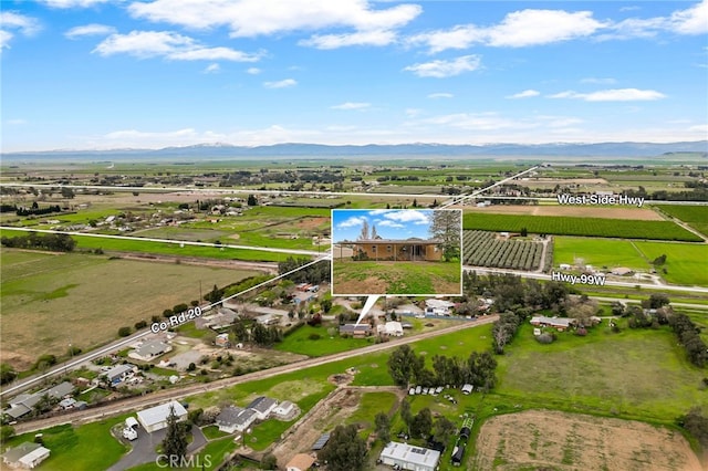 bird's eye view featuring a mountain view and a rural view