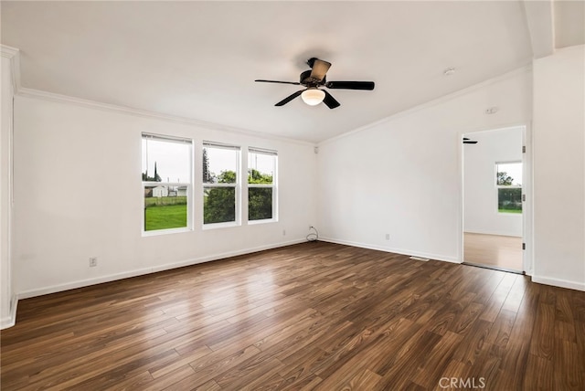 unfurnished room with baseboards, dark wood-type flooring, crown molding, and ceiling fan