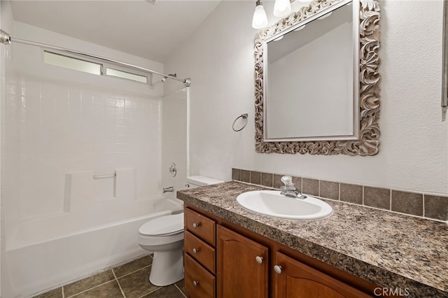 bathroom featuring toilet, vanity, tile patterned flooring, and bathing tub / shower combination