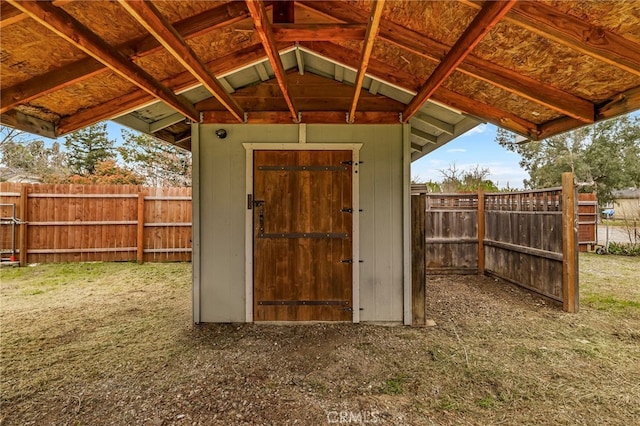 view of shed with a fenced backyard