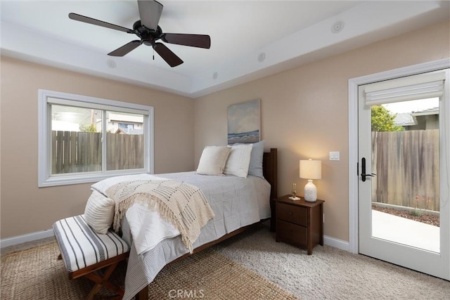bedroom with access to exterior, a ceiling fan, baseboards, and carpet floors