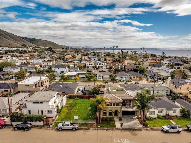 birds eye view of property featuring a residential view and a water view