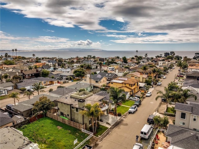 aerial view featuring a residential view and a water view