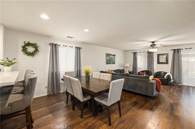 dining room featuring dark wood-type flooring, recessed lighting, ceiling fan, and baseboards