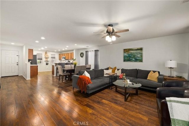 living room with ceiling fan, dark wood-style flooring, and recessed lighting