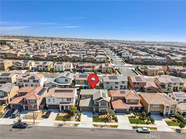 birds eye view of property with a residential view