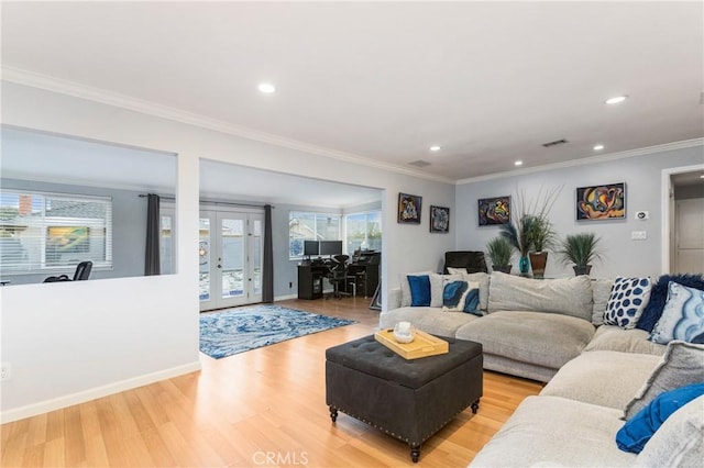 living area featuring recessed lighting, french doors, light wood-type flooring, and ornamental molding