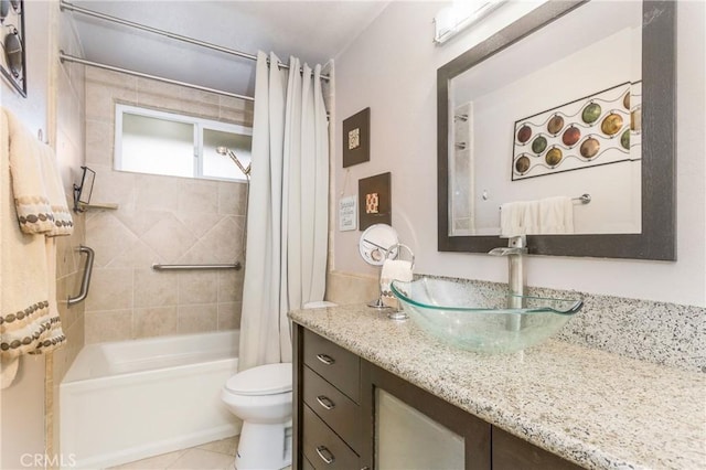 full bath featuring vanity, tile patterned floors, toilet, and shower / bathtub combination with curtain