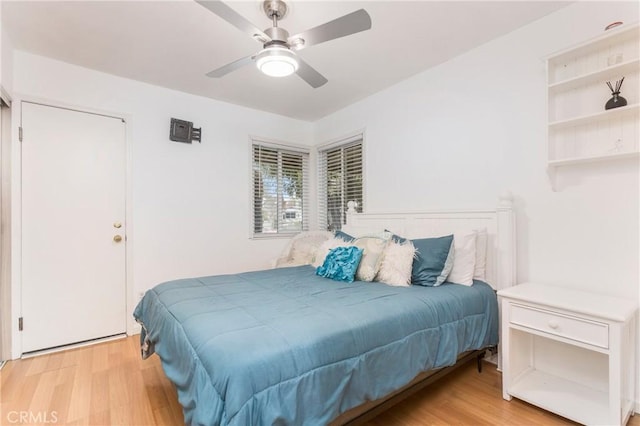 bedroom featuring a ceiling fan and wood finished floors