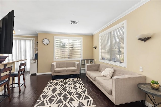 living room featuring ornamental molding, dark wood-type flooring, visible vents, and baseboards