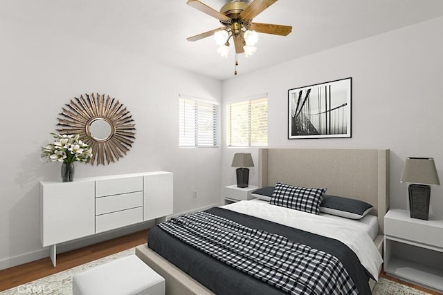 bedroom with ceiling fan, baseboards, and wood finished floors