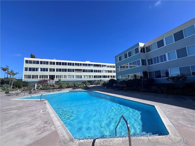 community pool featuring a patio area