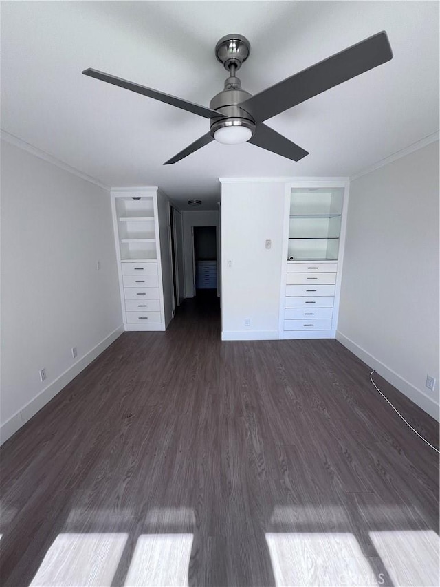 unfurnished bedroom featuring a ceiling fan, baseboards, ornamental molding, and dark wood-type flooring