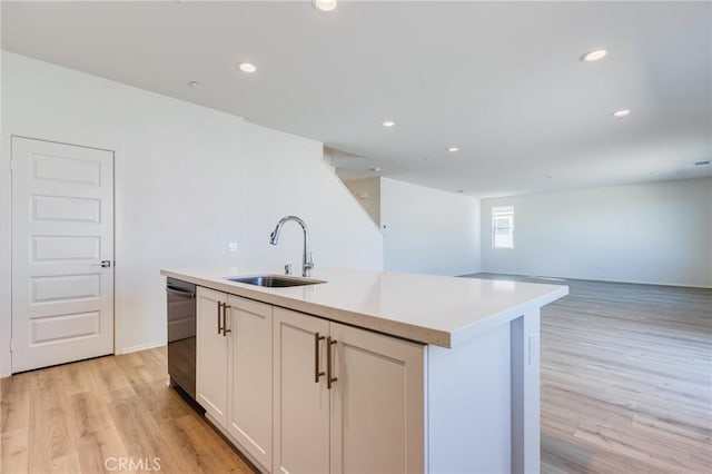 12990 Campbell Ct, Hesperia, CA 92344 - kitchen featuring dishwasher, light wood-style floors, a sink, and light countertops