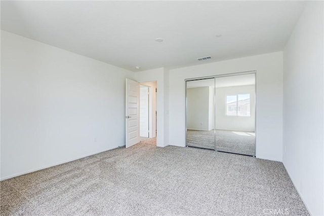 12990 Campbell Ct, Hesperia, CA 92344 - unfurnished bedroom featuring a closet, carpet flooring, and visible vents