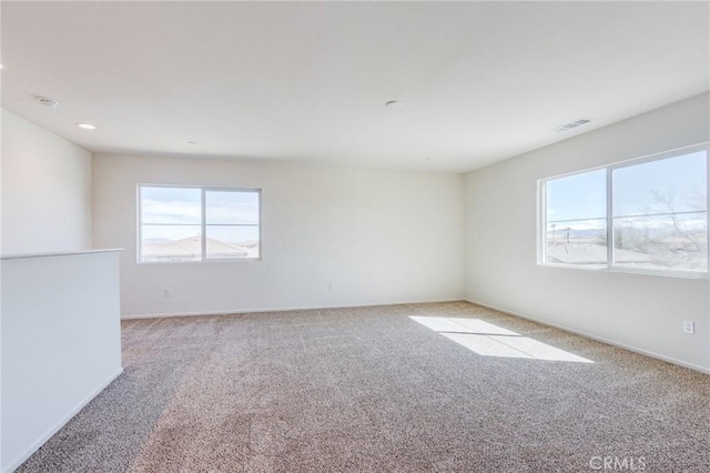 12990 Campbell Ct, Hesperia, CA 92344 - spare room with light carpet, baseboards, and visible vents