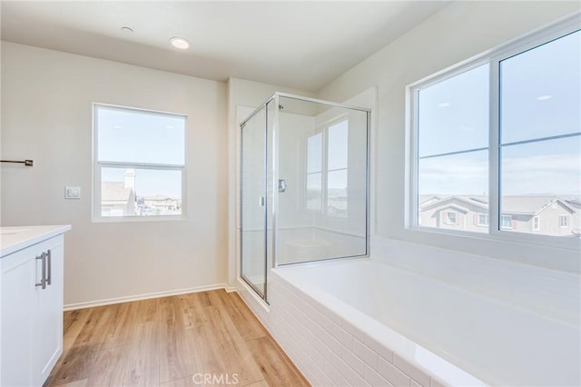 12990 Campbell Ct, Hesperia, CA 92344 - full bathroom featuring a stall shower, plenty of natural light, and vanity