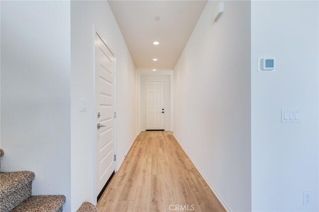 12990 Campbell Ct, Hesperia, CA 92344 - hallway with light wood-type flooring, stairway, and recessed lighting