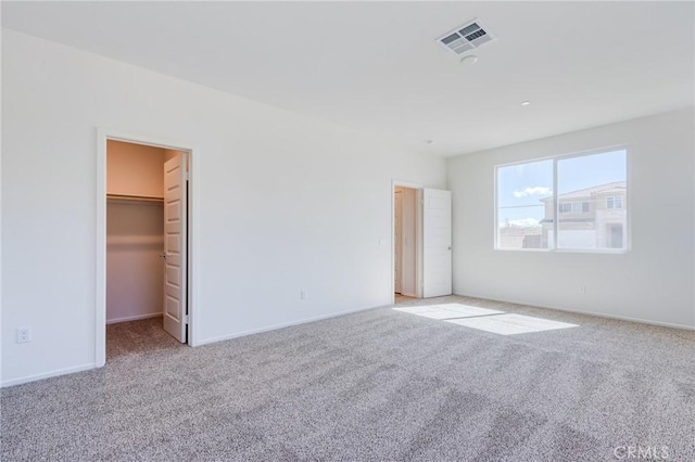 12990 Campbell Ct, Hesperia, CA 92344 - unfurnished bedroom featuring carpet, a walk in closet, visible vents, and baseboards