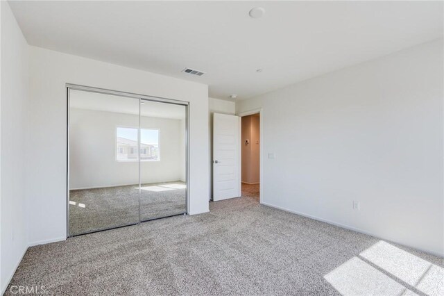 12990 Campbell Ct, Hesperia, CA 92344 - unfurnished bedroom featuring a closet, carpet flooring, visible vents, and baseboards