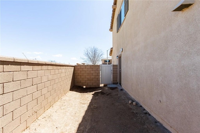 12990 Campbell Ct, Hesperia, CA 92344 - view of side of property with fence and stucco siding