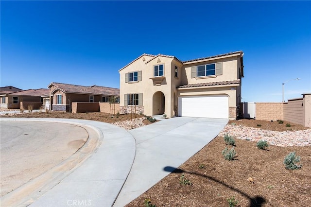 12990 Campbell Ct, Hesperia, CA 92344 - mediterranean / spanish home with a garage, fence, driveway, a tiled roof, and stucco siding