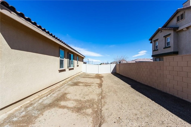 view of yard with a fenced backyard and a patio