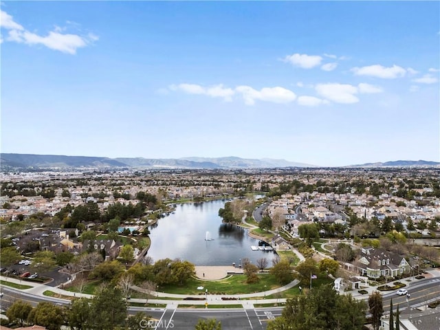 birds eye view of property with a residential view and a water and mountain view