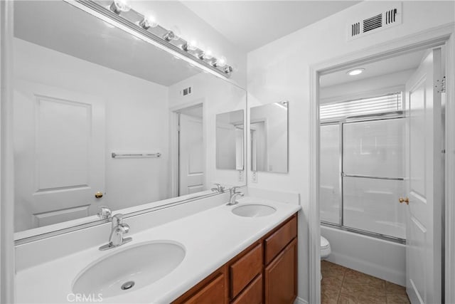 full bath with tile patterned flooring, visible vents, a sink, and toilet