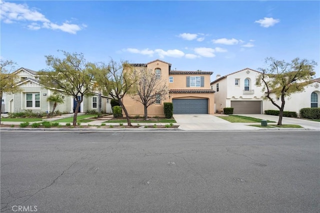 view of front of property featuring a garage, concrete driveway, a tiled roof, and stucco siding