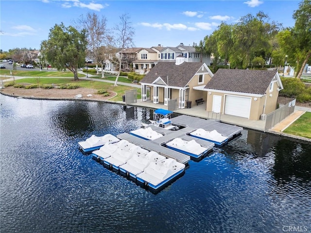 exterior space with a water view, a patio area, a residential view, and fence