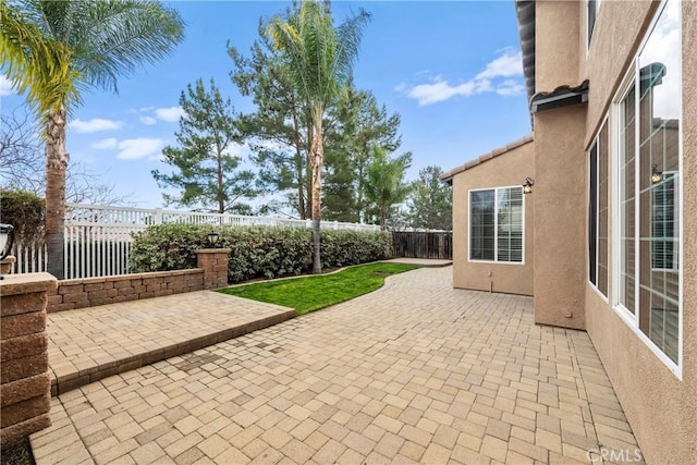 view of patio with a fenced backyard