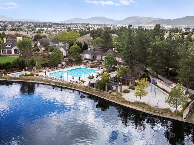 exterior space with a water and mountain view