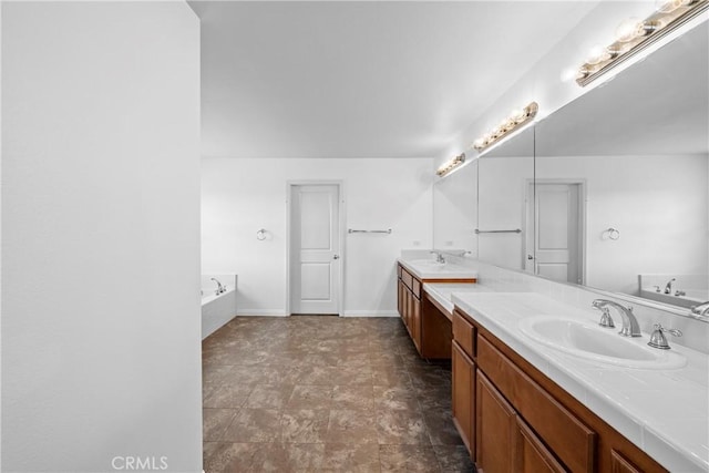 full bathroom with a bath, vanity, and baseboards