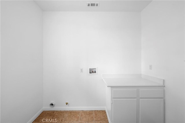 washroom with washer hookup, hookup for a gas dryer, visible vents, cabinet space, and baseboards