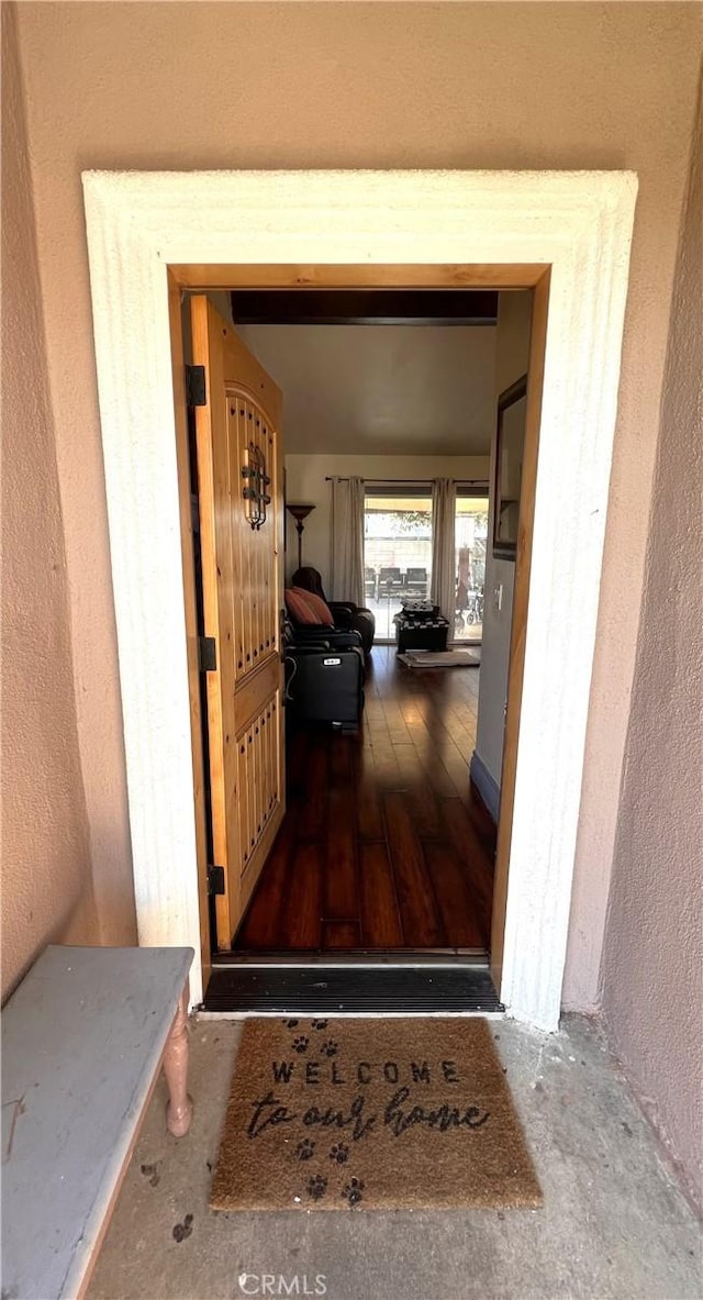 property entrance with stucco siding