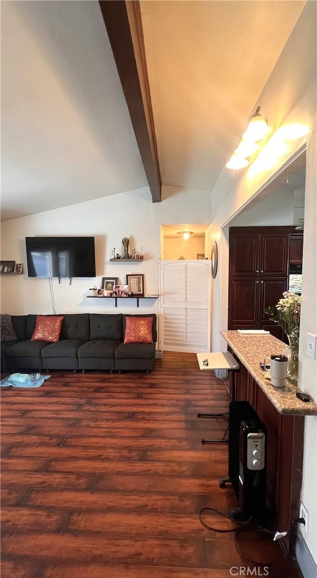 living room featuring lofted ceiling with beams and dark wood-type flooring