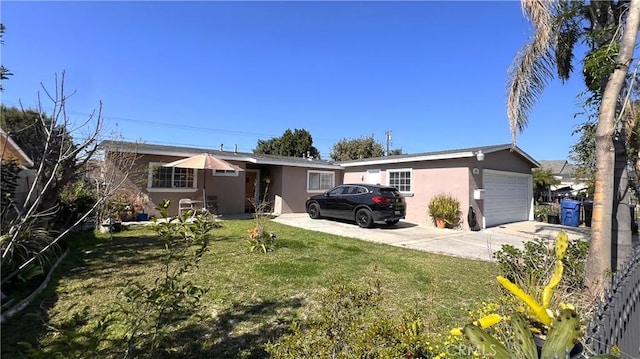 single story home featuring driveway, a front lawn, an attached garage, and stucco siding