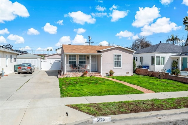 ranch-style house featuring covered porch, fence, crawl space, a gate, and a front yard