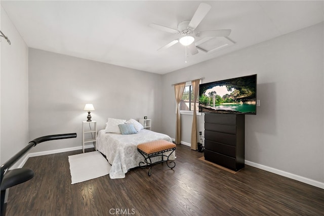 bedroom featuring ceiling fan, baseboards, and wood finished floors