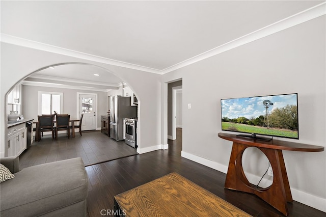 living room with dark wood-style floors, baseboards, arched walkways, and ornamental molding