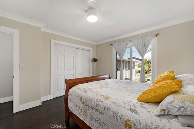 bedroom with ornamental molding, access to exterior, a closet, and baseboards