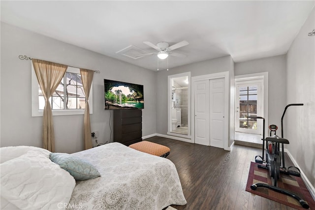 bedroom with dark wood-type flooring, a ceiling fan, baseboards, a closet, and ensuite bath