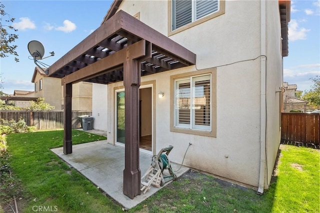 view of patio featuring fence and a pergola