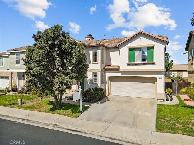 mediterranean / spanish-style house with concrete driveway, a chimney, a tiled roof, an attached garage, and stucco siding