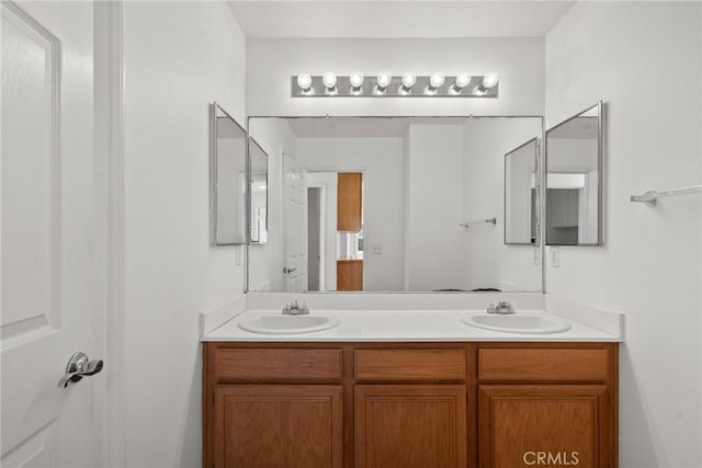 bathroom with double vanity and a sink