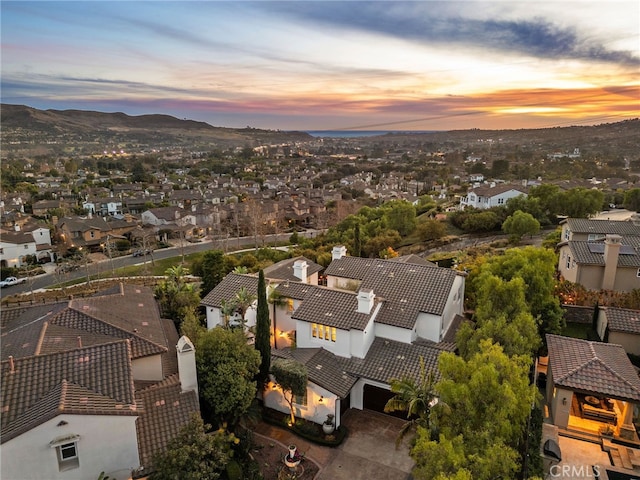 aerial view featuring a mountain view and a residential view