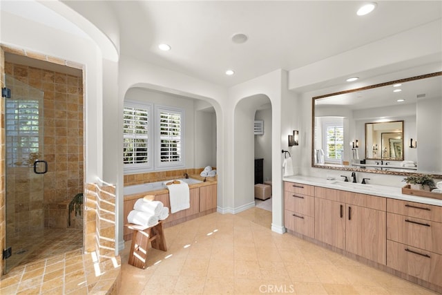 full bathroom with tile patterned floors, recessed lighting, a shower stall, a bath, and vanity